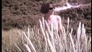 Cleo walking naked in the dunes