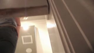 Blonde in fitting room puts on panty and tight jeans
