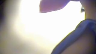 Doll hurries up to put on panty in the dressing room