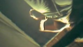 Dressed girl in fitting room is spied from below