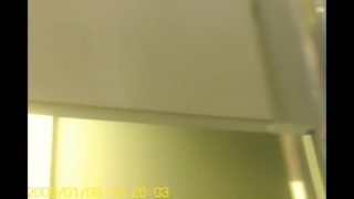 Girl in changing room admires her own reflection in mirror