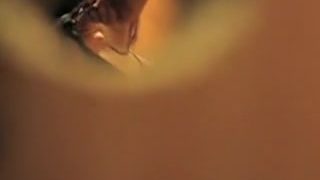 Girl spied through key hole baring tits off the bra