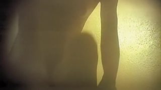 Naked bimbo in the dressing room getting clothed on spy cam
