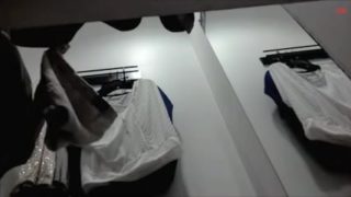 Sexy woman takes off her black panties on the spy camera