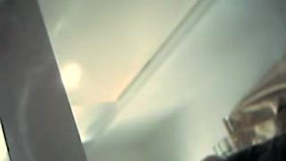 Spy cam chick demonstrates her long legs and sexy panty