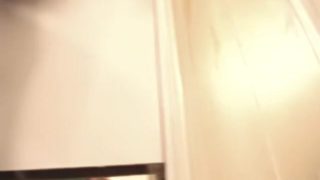 Trying on the luxurious night dresses in a fitting room