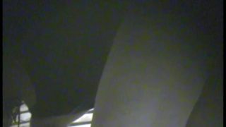 Unsuspecting chick undressing and flashing her tits