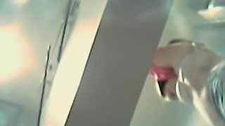 Woman flashes perky boobs in the changing room